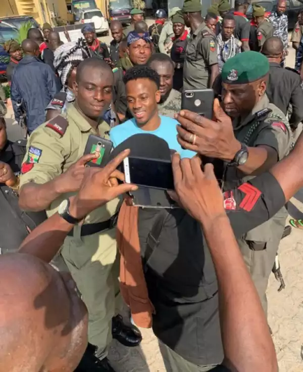 Korede Bello Shares Photos With Security Operatives At Their Base